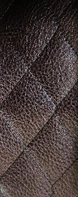 Chevy Quilted Cognac in Staples - Vinyls Brown Upholstery Polyester  Blend Fire Rated Fabric CA 117  Matelasse Faux Leather   Fabric