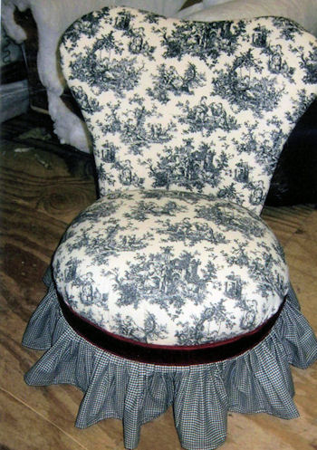 Vanity chair upholstered in toile pattern with plaid skirt