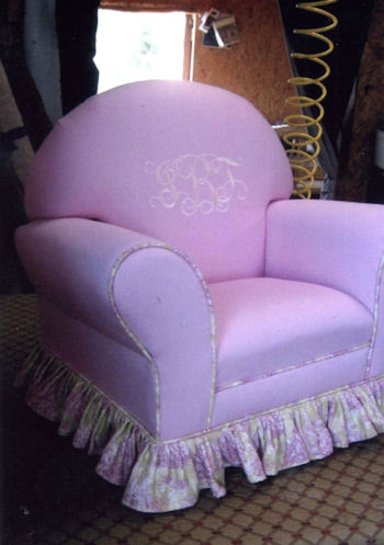 Easy chair upholstered in light purple velvet with toile skirt