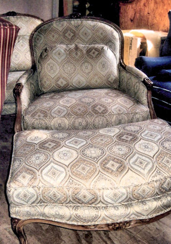 Victorian style chair and ottoman upholstered with pattern fabric