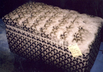 Footstool upholstered in jacquard diamond design fabric