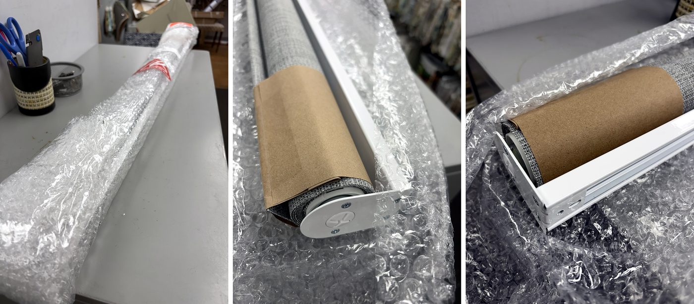 Cordless roller shade unboxed: bubble-wrapped package, fabric roll with end cap, and white headrail