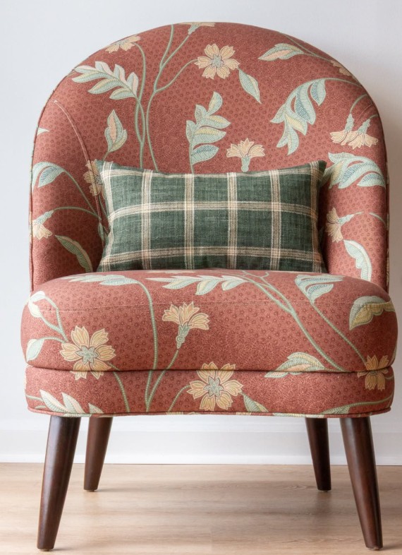 Richloom upholstered chair with a coordinating plaid pillow