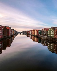 Colorful Houses At The River In Norway Wall Mural by  Brewster Wallcovering 